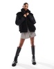ASOS DESIGN borg patched hybrid bomber jacket in black