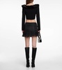Ruffle-trimmed pleated miniskirt