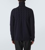Cable-knit wool turtleneck sweater