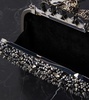 Knuckle embellished leather clutch