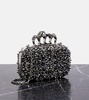 Knuckle embellished leather clutch